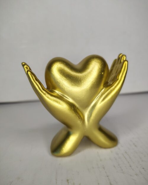 WhatsApp Image 2026-03-04 at 1.03.15 PM (1) Golden Hands Holding Heart Sculpture – Symbolic Love Décor Showpiece