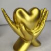 Golden Hands Holding Heart Sculpture – Symbolic Love Décor Showpiece